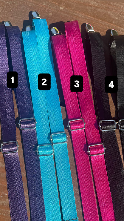 Four pairs of adjustable Backpack Straps in different colors (purple, turquoise, magenta, and black) arranged side-by-side on a wooden surface, with black numbered labels 1, 2, 3, and 4.