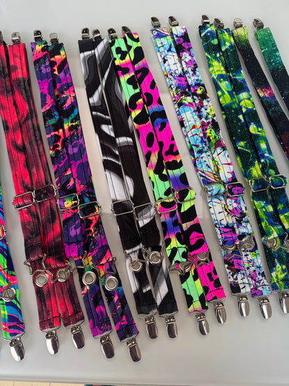 Another top view of sets of adjustable jacket straps to carry your coat hands-free. Comes in a variety of patterns with different attachment points.